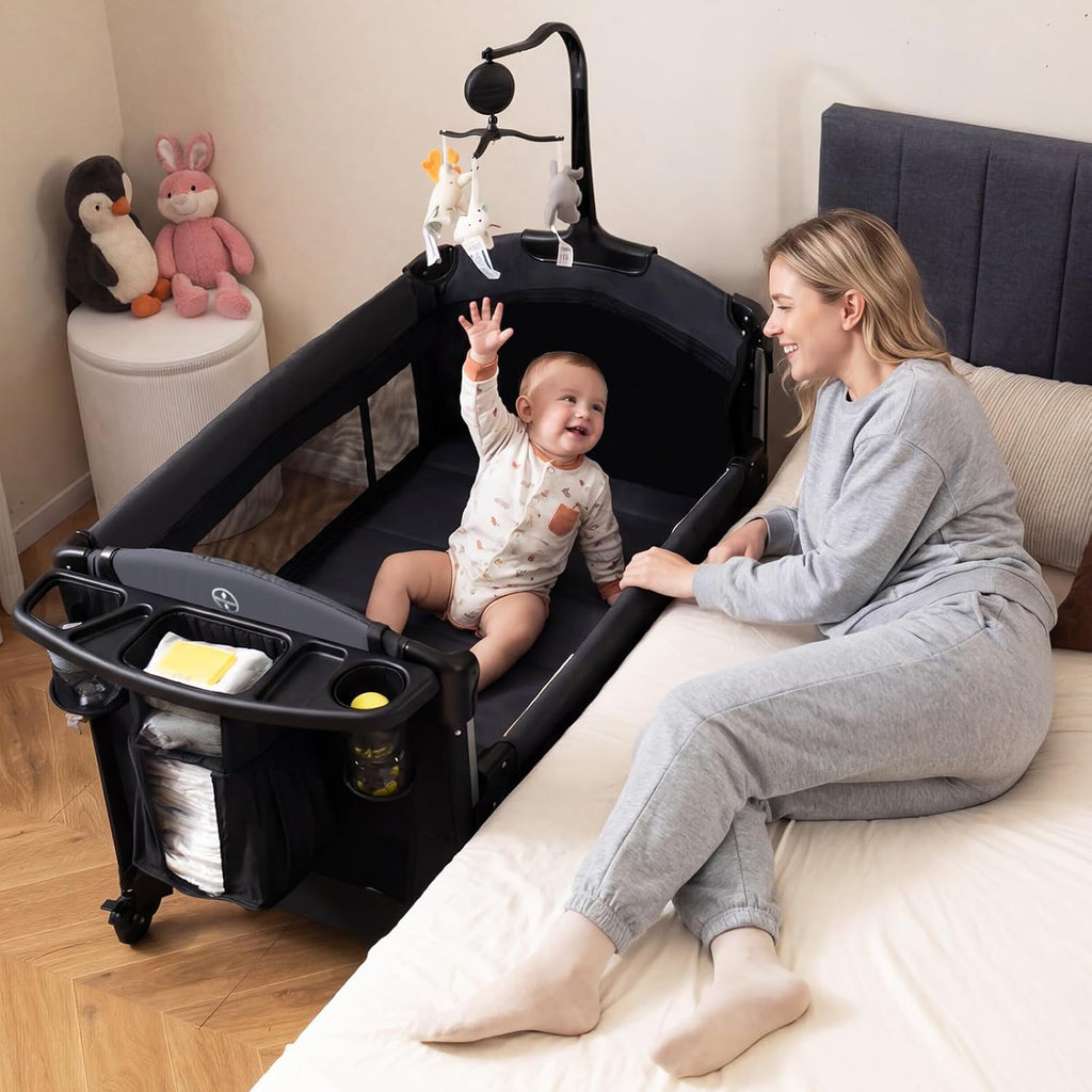 INFANS 4 in 1 Baby Bassinet, Converts Pack and Play to Portable Bedside Crib Sleeper with Diaper Changer, Mattress, Carry Bag, Music Box, Hanging Toys for Infants Toddlers (Black)
